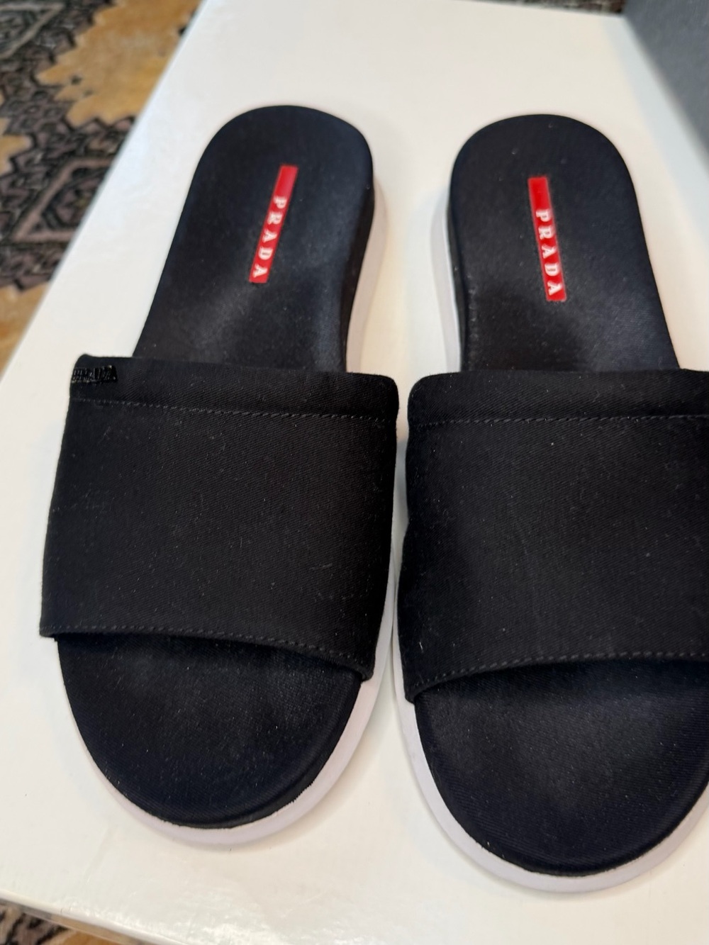 Prada Black Slides with White Contrasting Sole and Red Logo